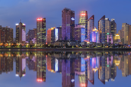 彩色灯光素材海滨城市建筑夜景背景
