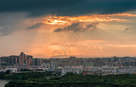 光芒楼群城市晚霞耶稣光背景