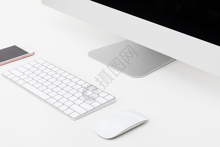 智能鼠标摆放整齐简洁的苹果电脑一体机背景