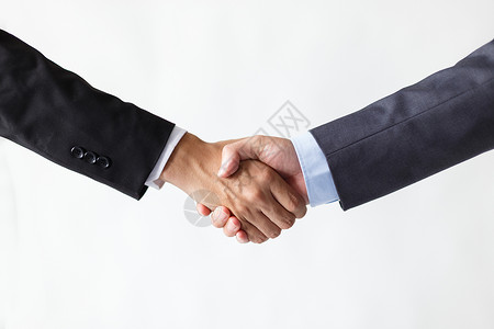 商业谈判握手的商务人士背景