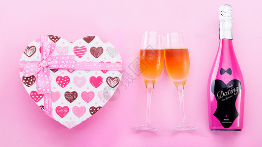 粉色约会心形礼盒高脚杯起泡酒素材背景