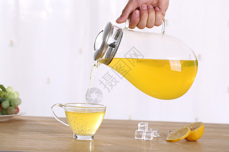 玻璃茶壶柠檬水背景图片