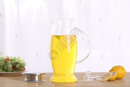 玻璃茶壶柠檬茶背景图片