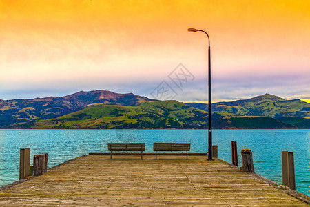 新西兰日落美景海边码头日出美景背景