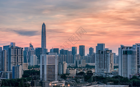 大气写字楼红霞中的城郭建筑城市风光背景