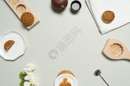 木圆桌月饼与茶摆拍图背景