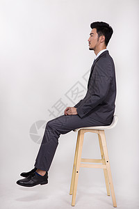 坐在椅子上的商务人士高清图片
