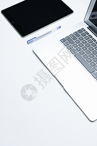 苹果电脑屏幕桌面上的办公电子产品背景
