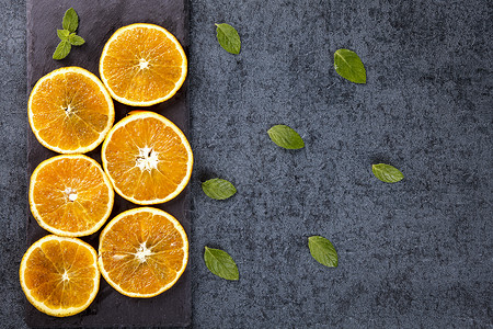 橙色深色新鲜橙子切片背景背景