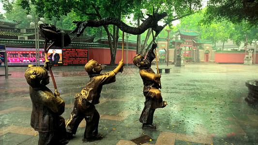 公园党建雕塑雨天佛山祖庙背景