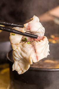 火锅涮鱼片背景图片