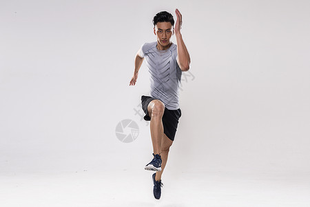运动男士跑步动作背景图片