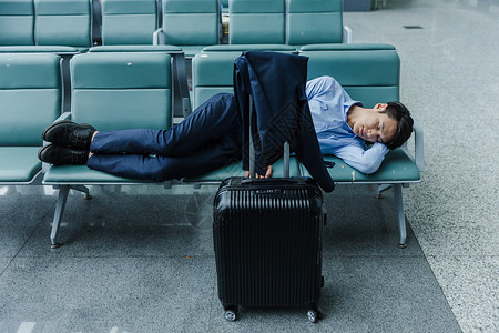 机场候机座椅商务男士睡觉图片