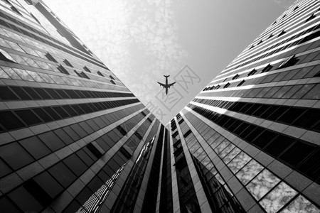 航空主题黑白商业飞机与建筑背景