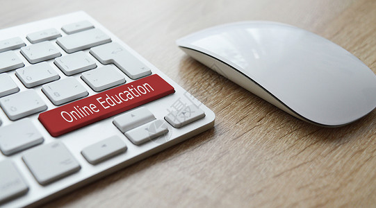 笔记本电脑鼠标在线教育键盘上的红色按键设计图片
