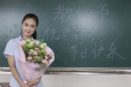 敬业的老师教师节女老师收到鲜花背景