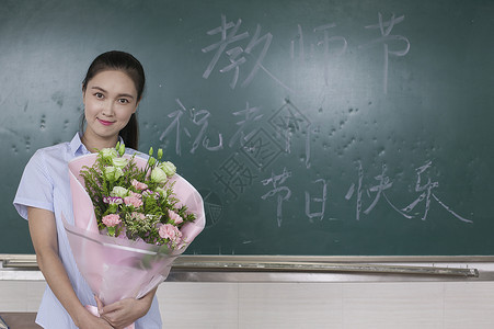 优秀班主任教师节女老师收到鲜花背景