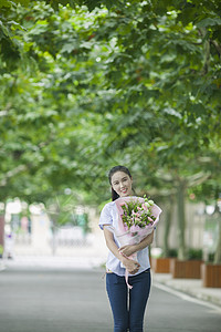 礼献教师节教师节女老师收到学生献的花背景