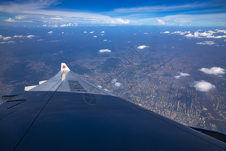 国航俯瞰广州城市背景图片