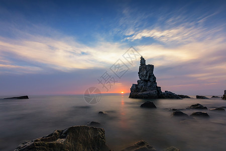 平静海上日落将军石落日背景