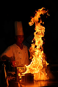 厨师操作铁板烧火焰背景