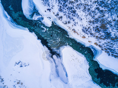 航拍冬季阿尔山不冻河背景图片
