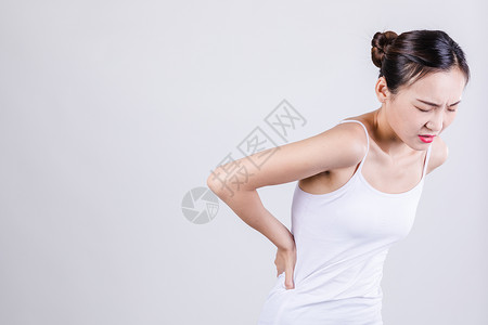 腰痛女居家女人表现腰疼情绪背景