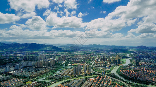 先进模范蓝天白云下的南方城市背景