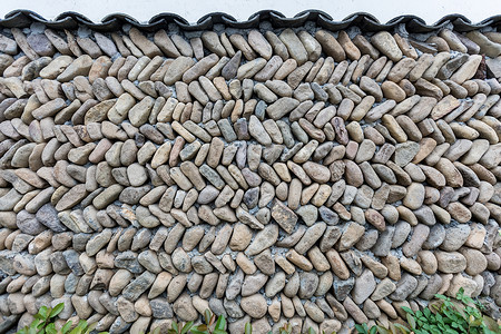 风雨中鹅卵石鹅卵石堆砌的墙背景