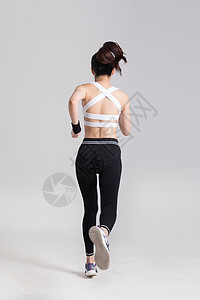 奔跑跑步的运动女性背影图片