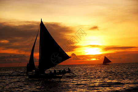 落日帆船海边长滩岛高清图片