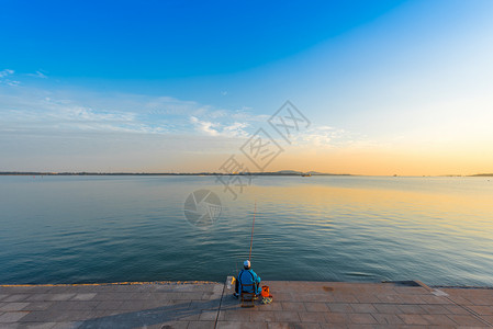 钓鱼椅子青岛海边日落最美夕阳背景