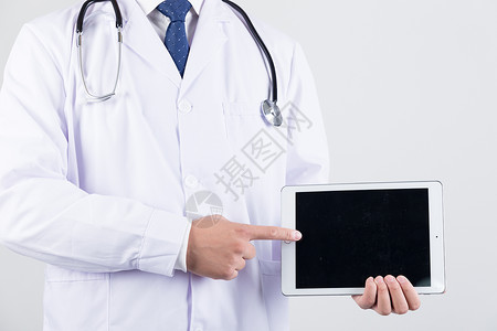 医疗听诊底图正在使用平板电脑的医生背景