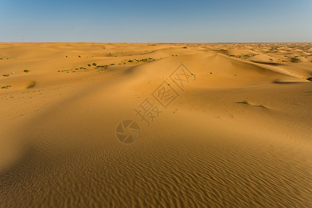 一轮烈日新疆阿拉善腾格里沙漠背景