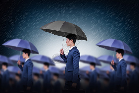 雨中行走的商务人士背景图片