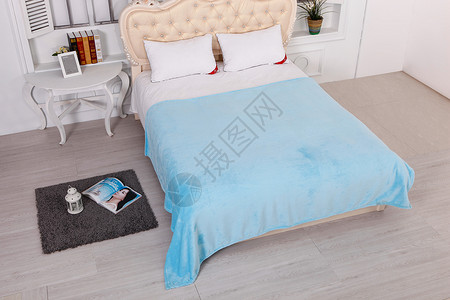 珊瑚绒面料卧室床和毛毯背景