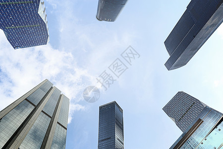 广州握手商务合作仰望广州天河CBD的高楼大厦背景
