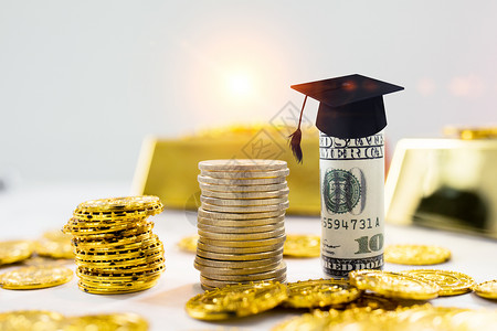 金融黄金素材学士帽与钱币设计图片