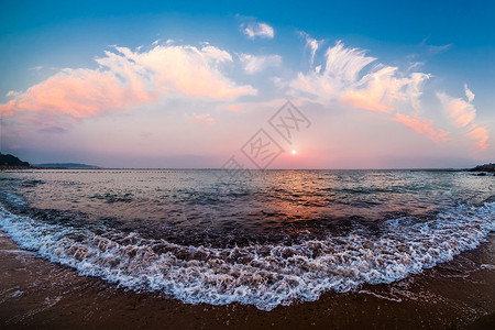 潮水潮向青岛海边的日落背景