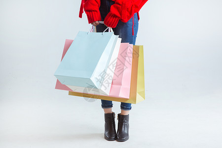 拎购物袋的时尚女性购物时尚女性手拎购物袋棚拍背景