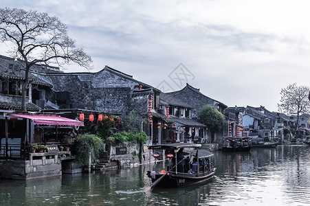 江南水乡西塘河流乌篷船背景图片