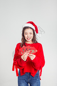 圣诞节发红包的女性背景图片