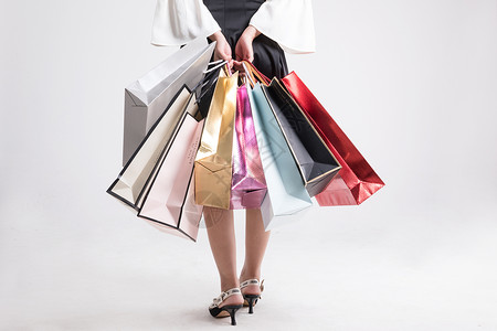 女性手提购物袋背景图片
