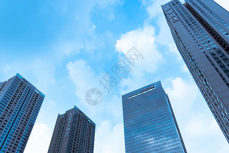海报春日唯美蓝粉城市大楼天空背景背景