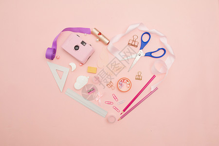 粉色背景上的文具背景图片