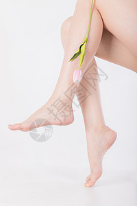 花脚蚊美容形体腿部与花特写背景