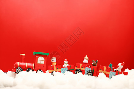 圣诞雪地里的玩具火车背景图片