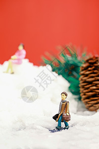 卡通松果圣诞装置雪地里小人和大松果背景