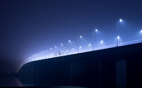 黑夜公路素材钱塘江大桥夜晚迷雾下的路灯背景