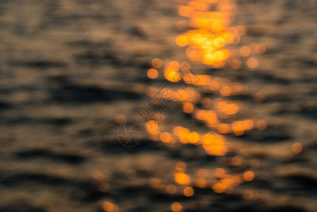 黄色粒子海波浪海水水面波纹光斑背景